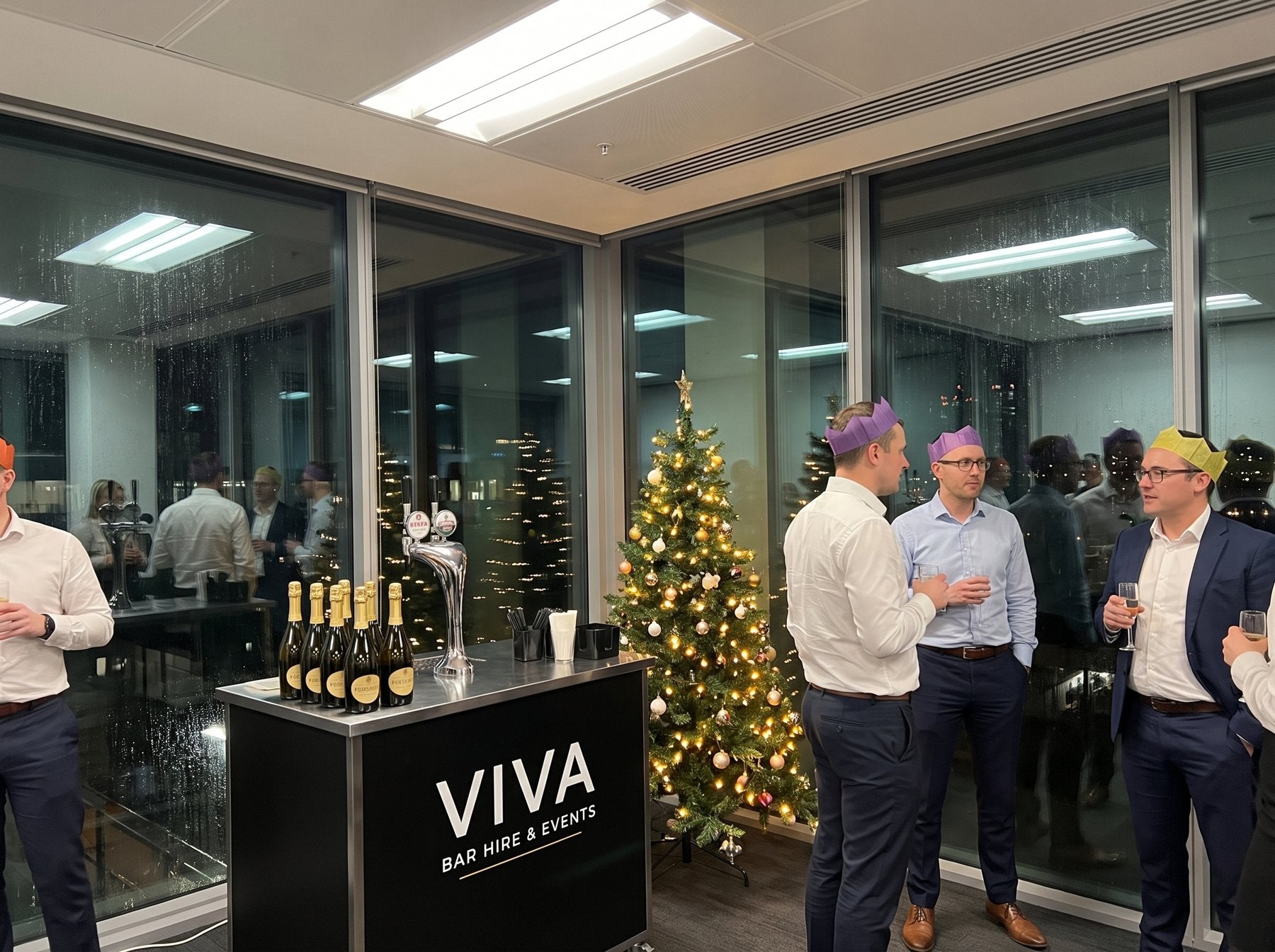 Corporate event with VIVA bar and suited guests