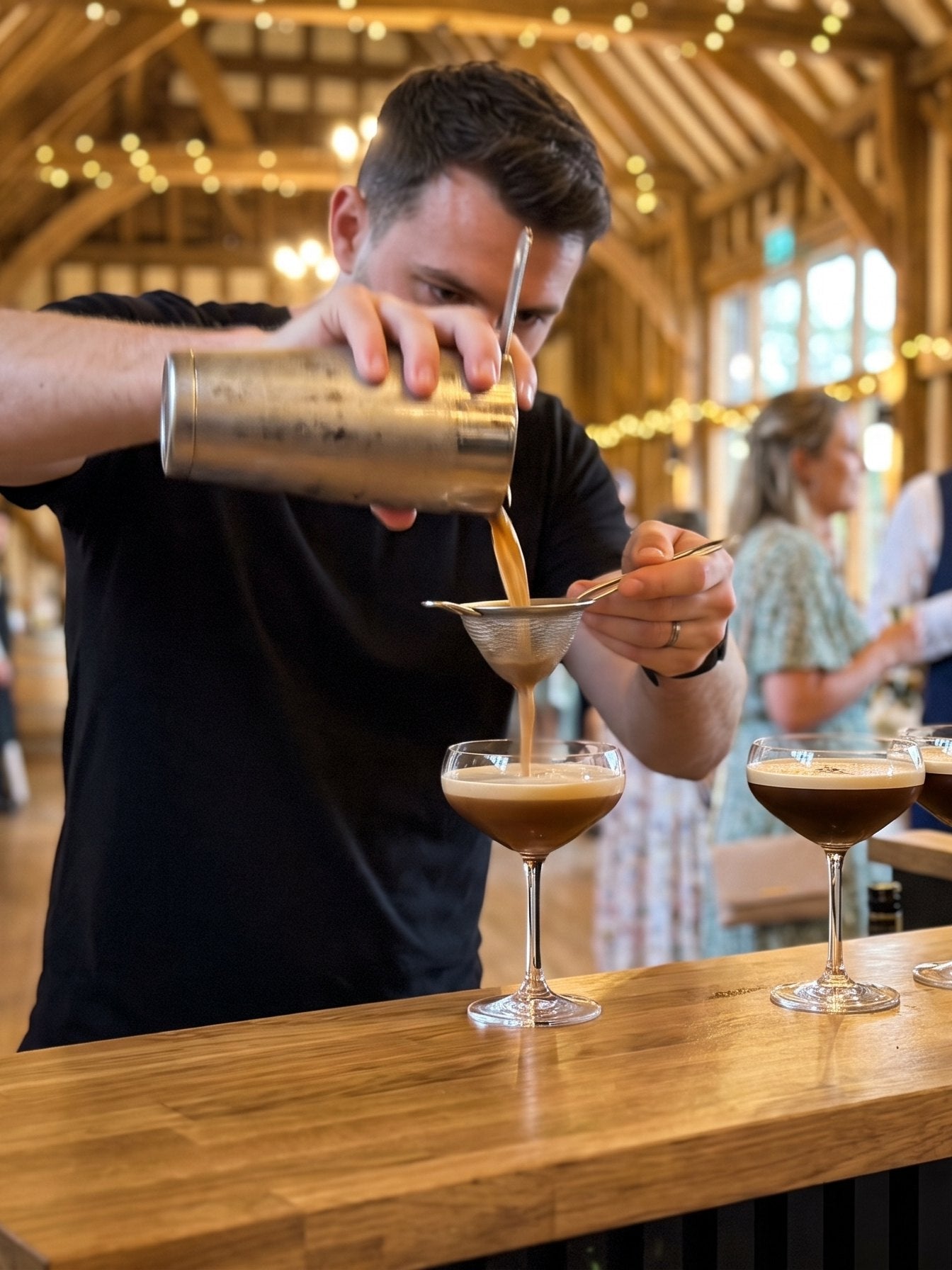 VIVA bartender pouring espresso martinis at a cocktail party