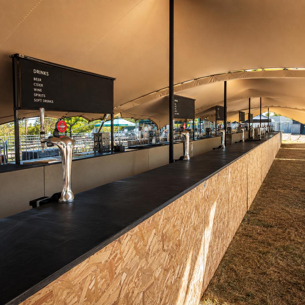 Festival bar setup at a large outdoor event
