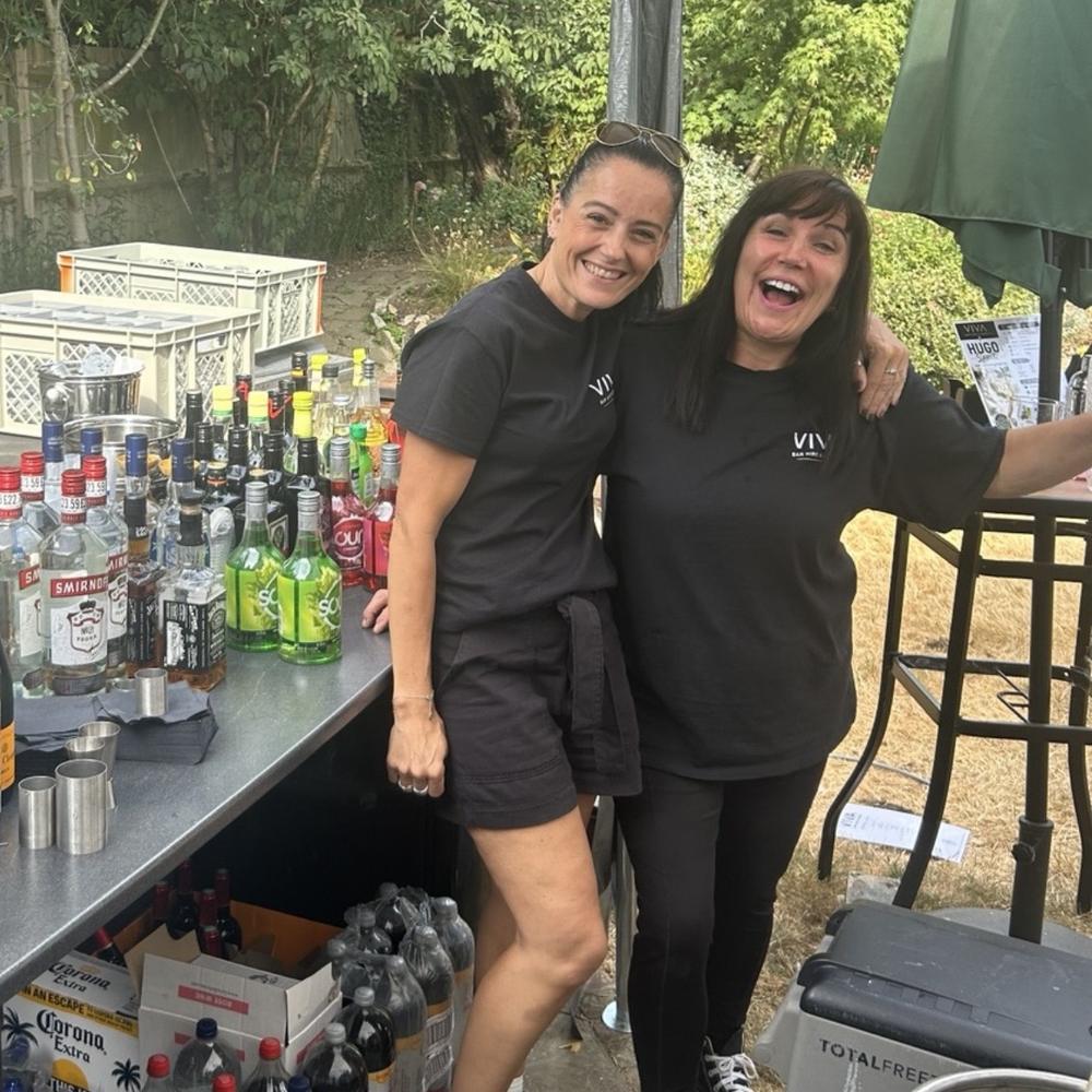 VIVA event staff working behind a bar
