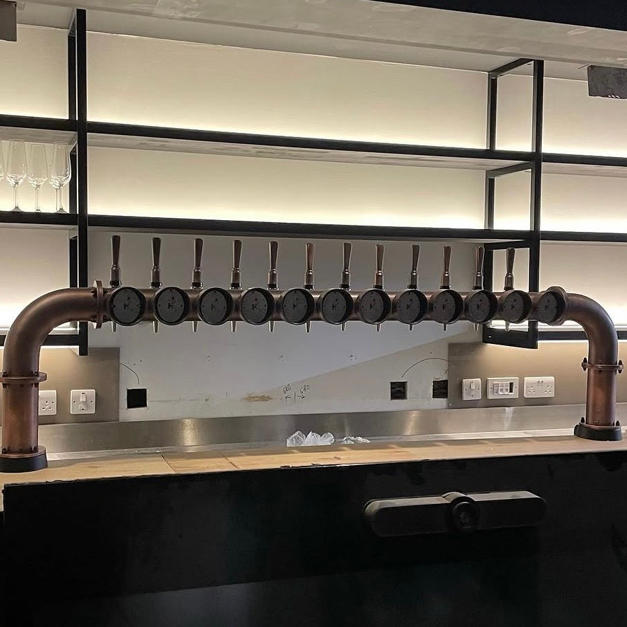 Modern copper T-bar installation with backlit shelving
