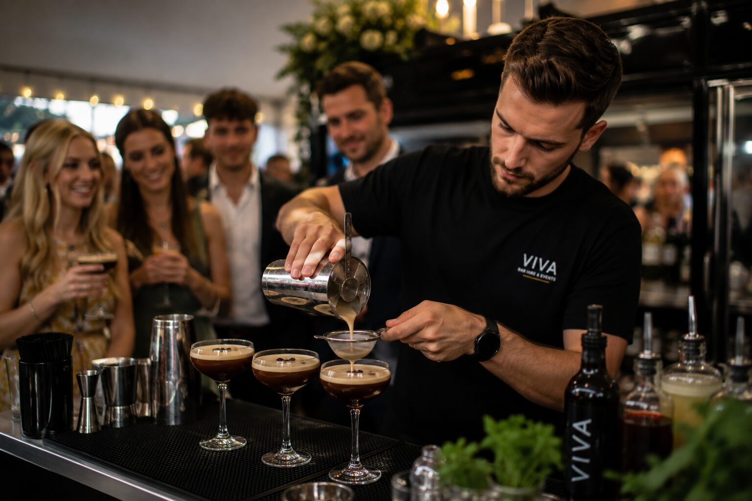 VIVA bartender pouring espresso martinis at a cocktail party
