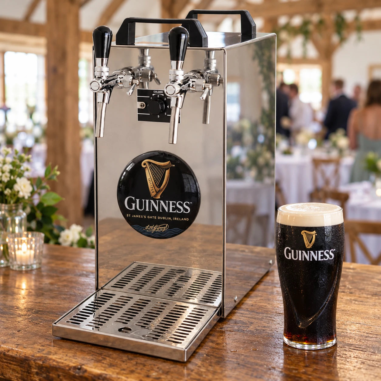 Twin tap dispenser pouring Guinness at a barn wedding