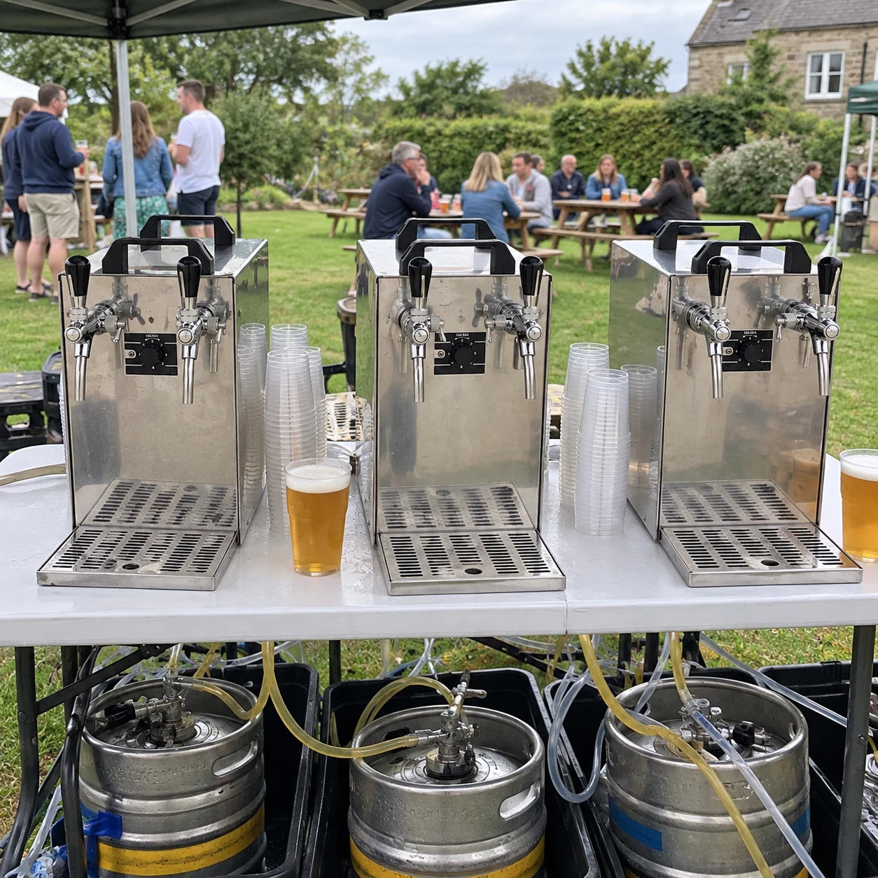 Beer dispensers running from kegs at an outdoor event